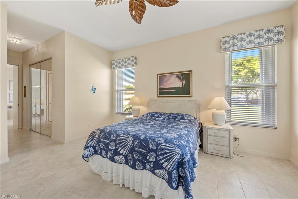 9097 Springview Loop Estero, FL 33928 - Photo 26 of 50 a bedroom with a bed and a window