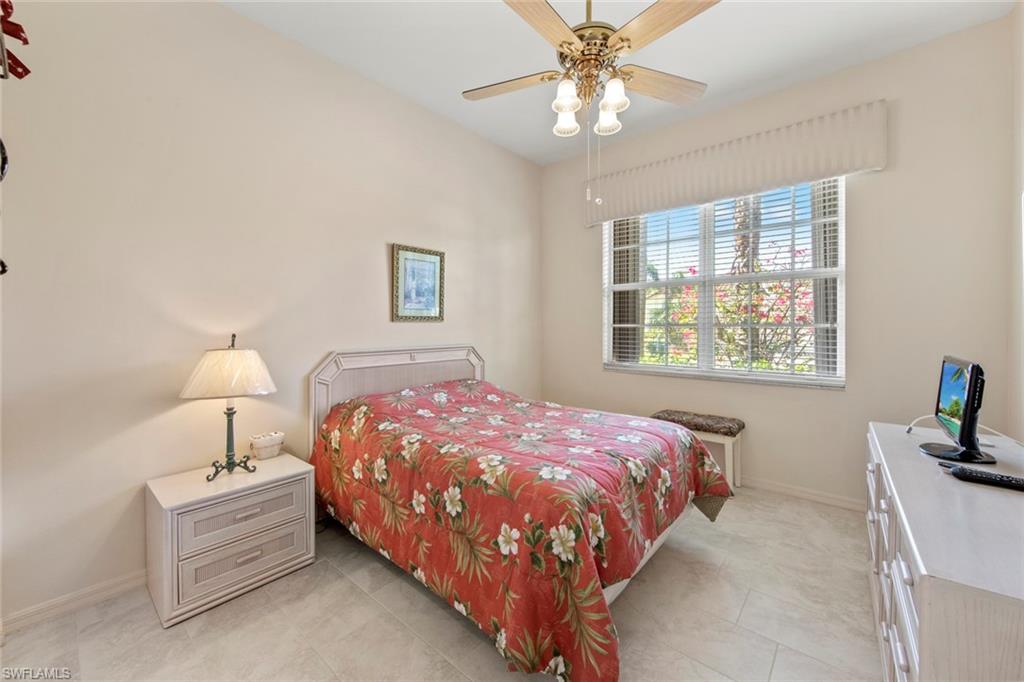 9097 Springview Loop Estero, FL 33928 - Photo 29 of 50 a bedroom with a bed and a window