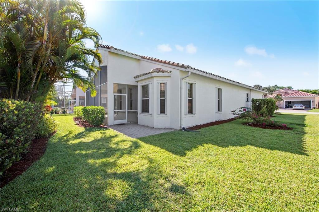 9097 Springview Loop Estero, FL 33928 - Photo 3 of 50 a view of a house with a backyard