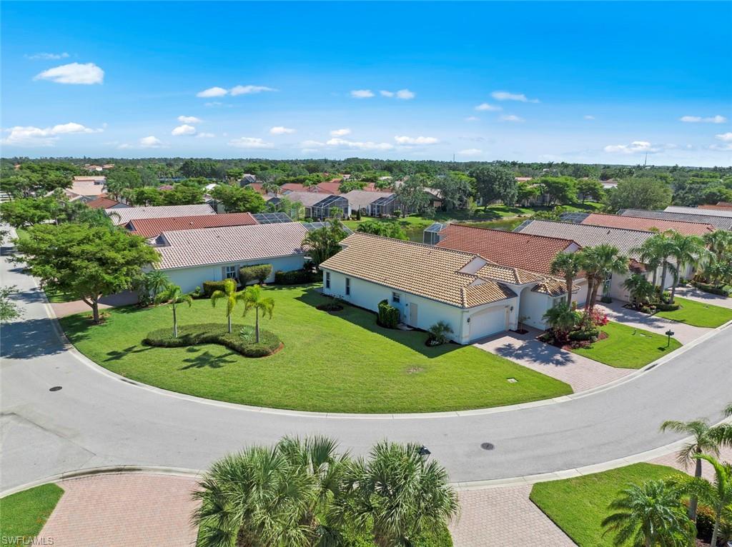 9097 Springview Loop Estero, FL 33928 - Photo 40 of 50 an aerial view of a house with garden space and ocean view