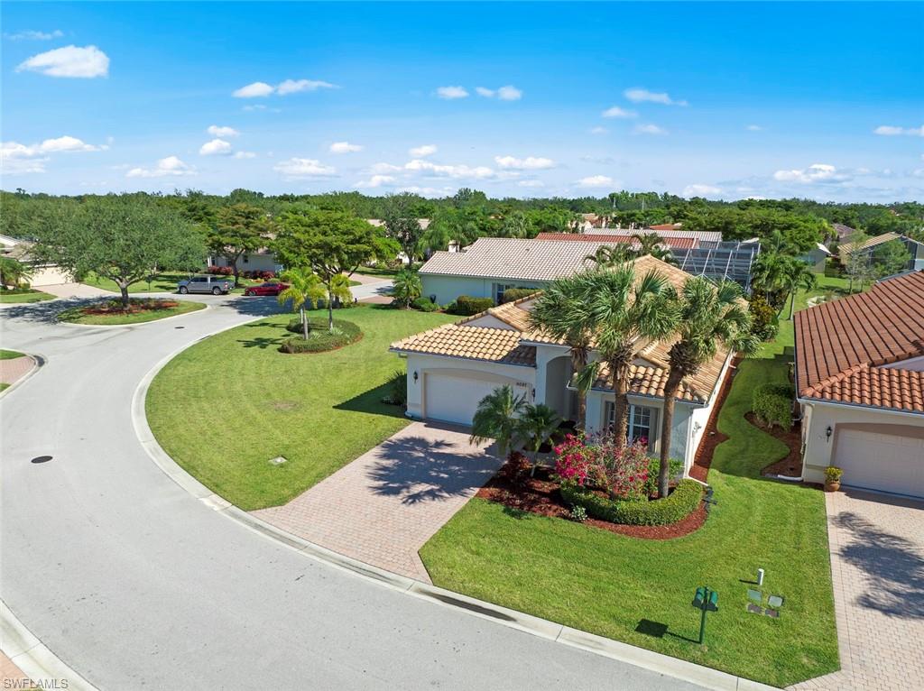 9097 Springview Loop Estero, FL 33928 - Photo 41 of 50 an aerial view of a house with swimming pool garden and lake view