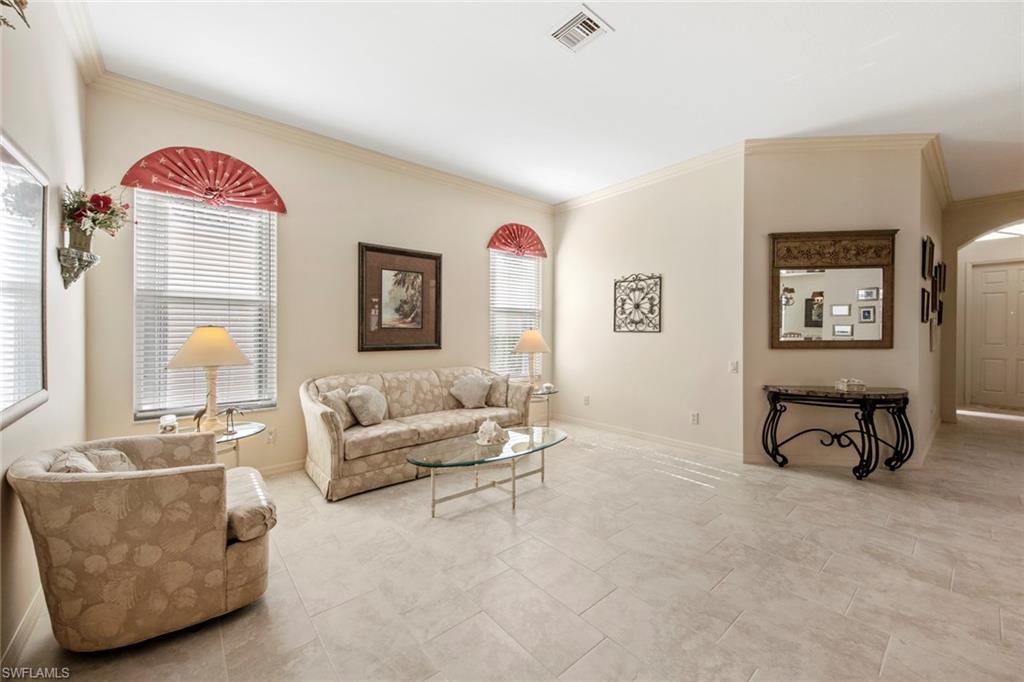 9097 Springview Loop Estero, FL 33928 - Photo 8 of 50 a living room with furniture and a couch