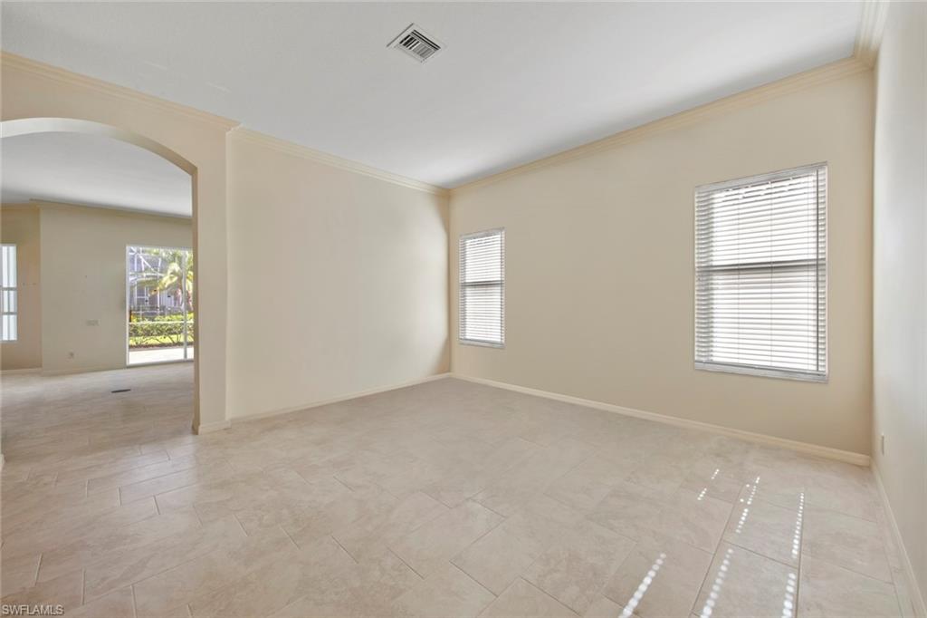 9097 Springview Loop Estero, FL 33928 - Photo 10 of 50 an empty room with windows