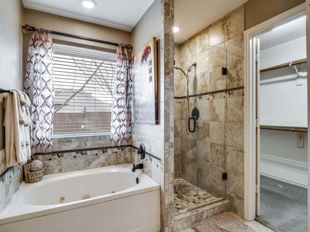 1317 Chestnut Drive Rowlett, TX 75089 - Photo 13 of 25 a bathroom with a bathtub and shower