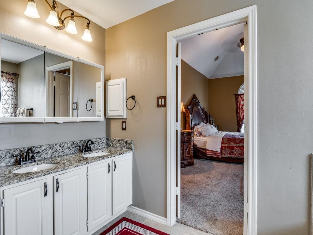 1317 Chestnut Drive Rowlett, TX 75089 - Photo 14 of 25 a en suite bathroom with a sink a mirror and a shower