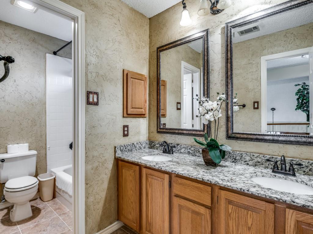 1317 Chestnut Drive Rowlett, TX 75089 - Photo 17 of 25 a bathroom with a granite countertop sink and a mirror