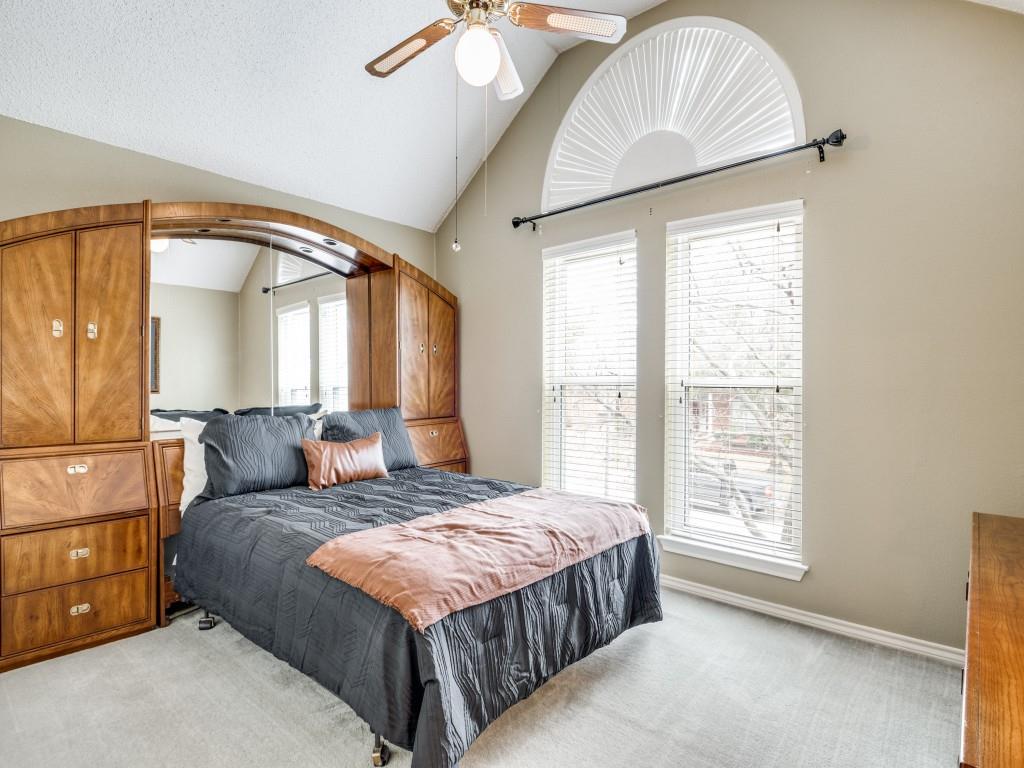 1317 Chestnut Drive Rowlett, TX 75089 - Photo 19 of 25 a bedroom with a large bed and a window