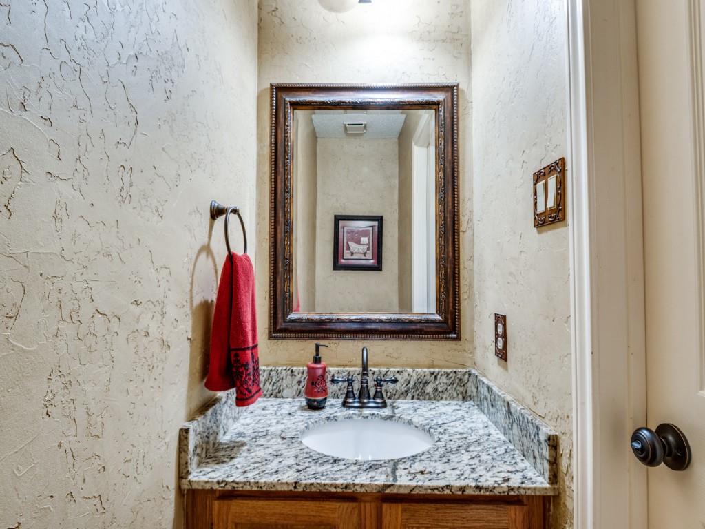 1317 Chestnut Drive Rowlett, TX 75089 - Photo 10 of 25 a bathroom with a granite countertop sink and a mirror