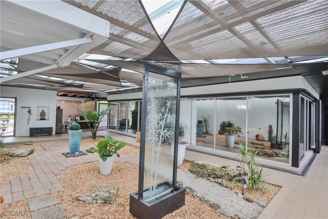 3666 Princeton Street Fort Myers, FL 33901 - Photo 18 of 38 a view of a porch with a table and chairs