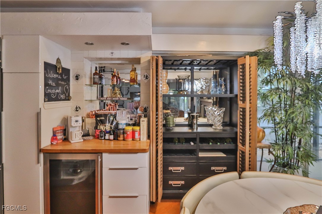 3666 Princeton Street Fort Myers, FL 33901 - Photo 22 of 38 a bedroom with a bed and a mirror on dresser