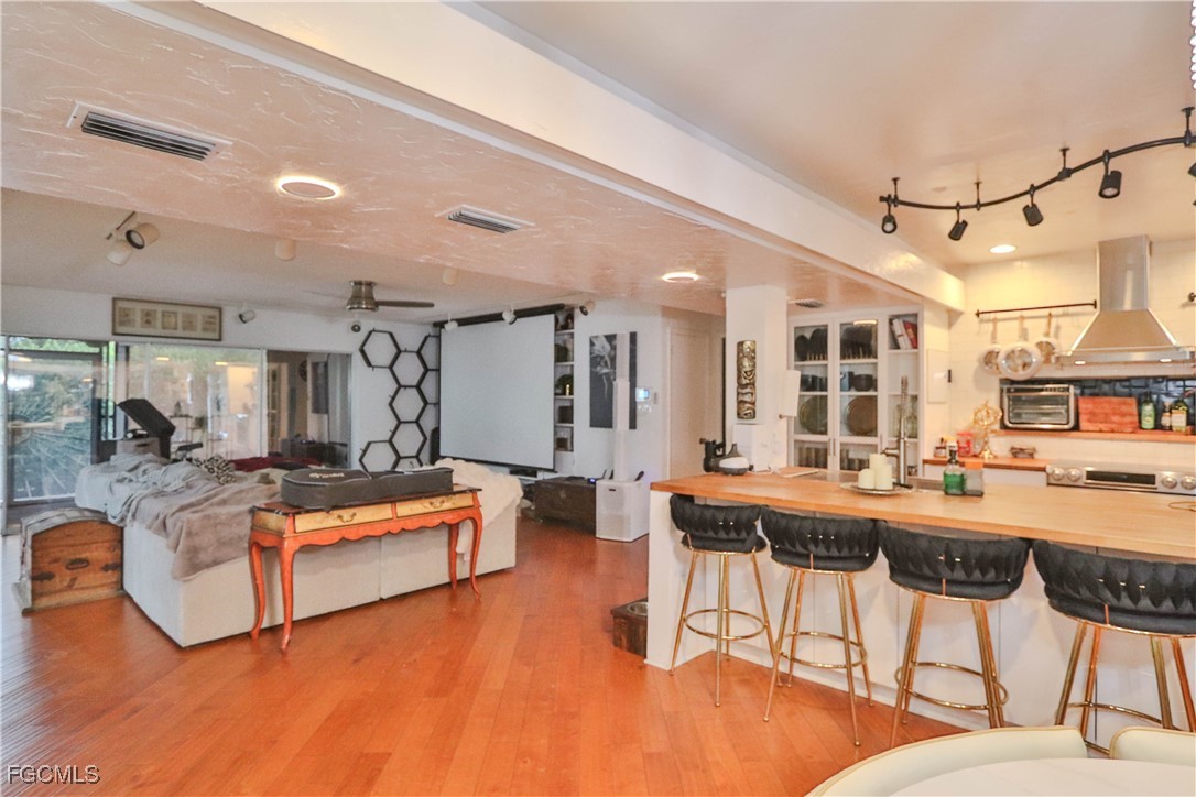 3666 Princeton Street Fort Myers, FL 33901 - Photo 25 of 38 a living room with fireplace furniture and a table