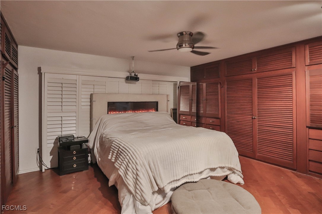 3666 Princeton Street Fort Myers, FL 33901 - Photo 27 of 38 a bedroom with a bed and a chandelier