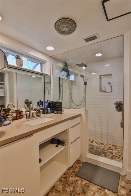 3666 Princeton Street Fort Myers, FL 33901 - Photo 28 of 38 a bathroom with a double vanity sink mirror and shower