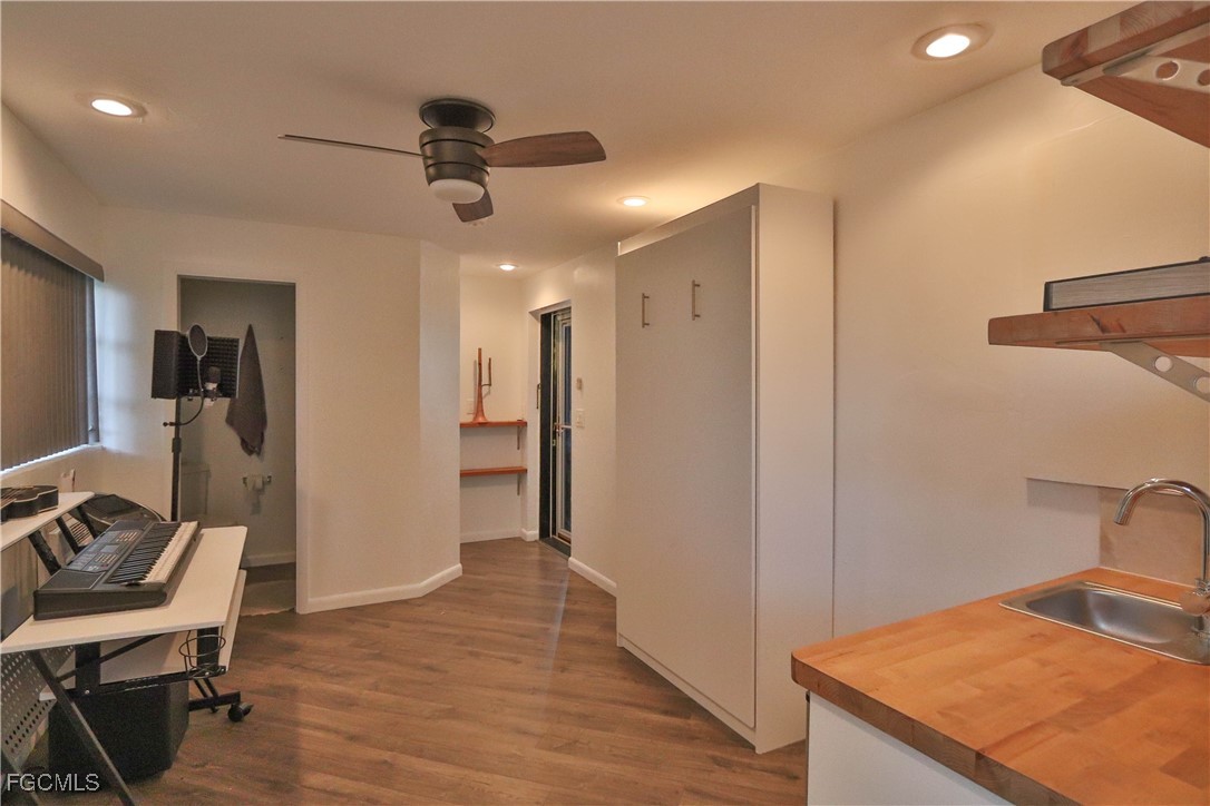3666 Princeton Street Fort Myers, FL 33901 - Photo 35 of 38 a view of a hallway with a kitchen