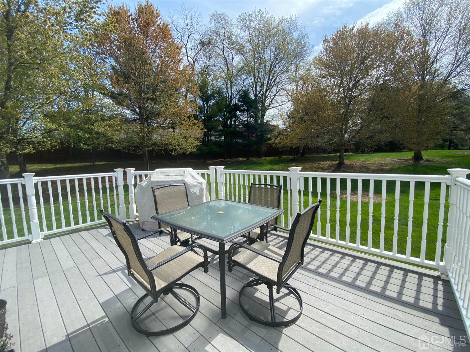 56 Whitehead Road Bridgewater, NJ 08807 - Photo 34 of 42 a view of a chairs and table on the deck