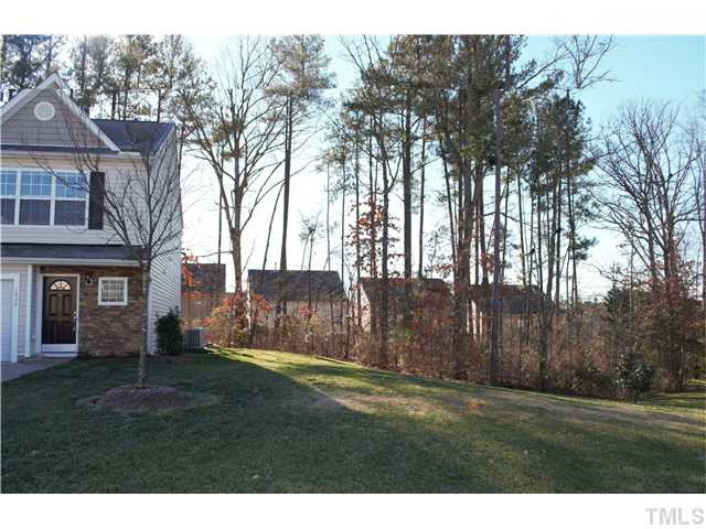 1928 Raj Drive Durham, NC 27703 - Photo 2 of 8 a backyard of a house with table and chairs