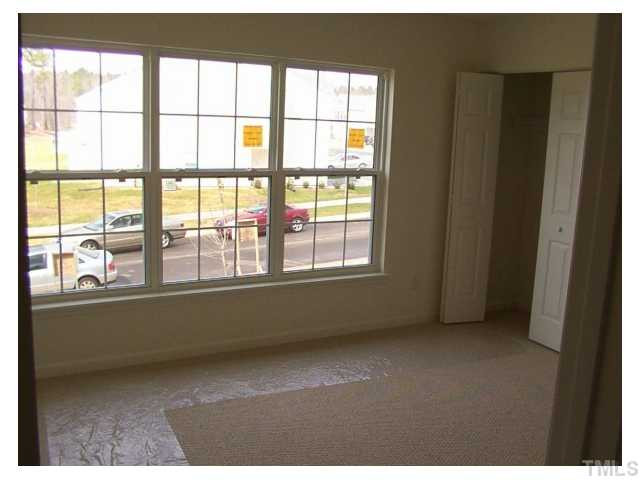 1928 Raj Drive Durham, NC 27703 - Photo 4 of 8 a view of an empty room with a window