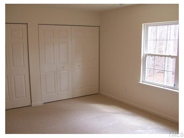 1928 Raj Drive Durham, NC 27703 - Photo 5 of 8 a view of an empty room with a window