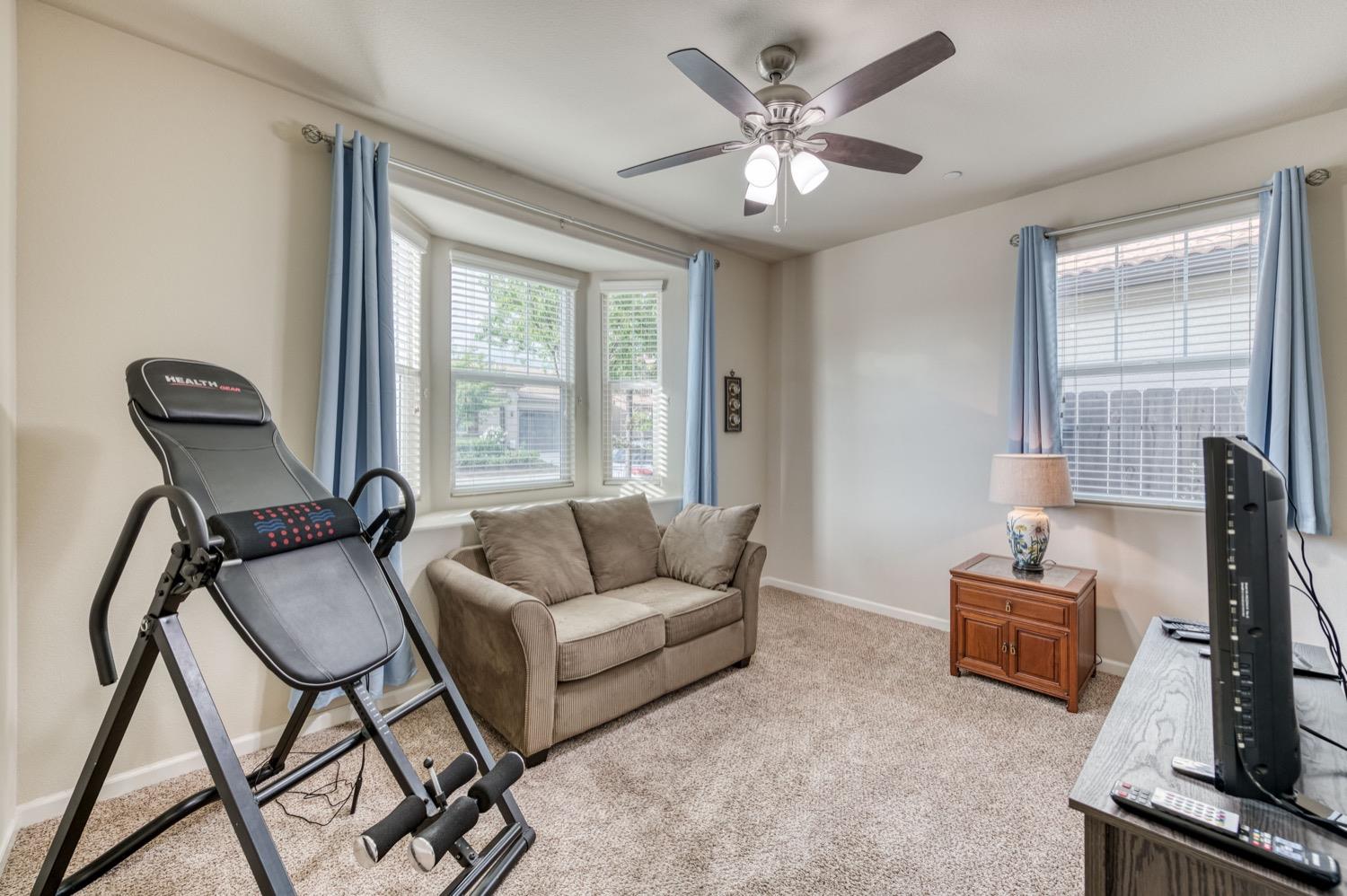 3610 Griffith Avenue Clovis, CA 93619 - Photo 11 of 22 a living room with furniture and a flat screen tv