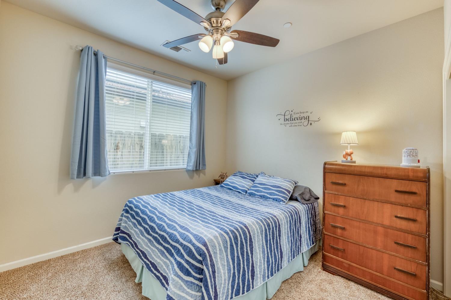 3610 Griffith Avenue Clovis, CA 93619 - Photo 15 of 22 a bedroom with a bed and a dresser