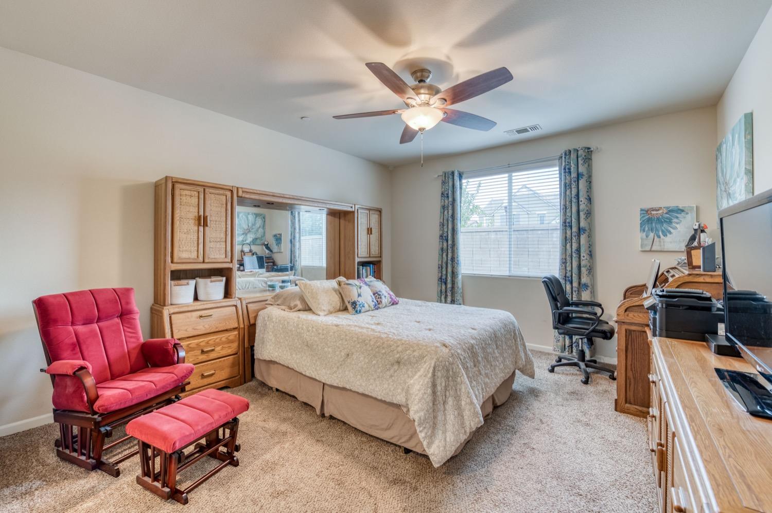 3610 Griffith Avenue Clovis, CA 93619 - Photo 17 of 22 a bedroom with a bed and a couch