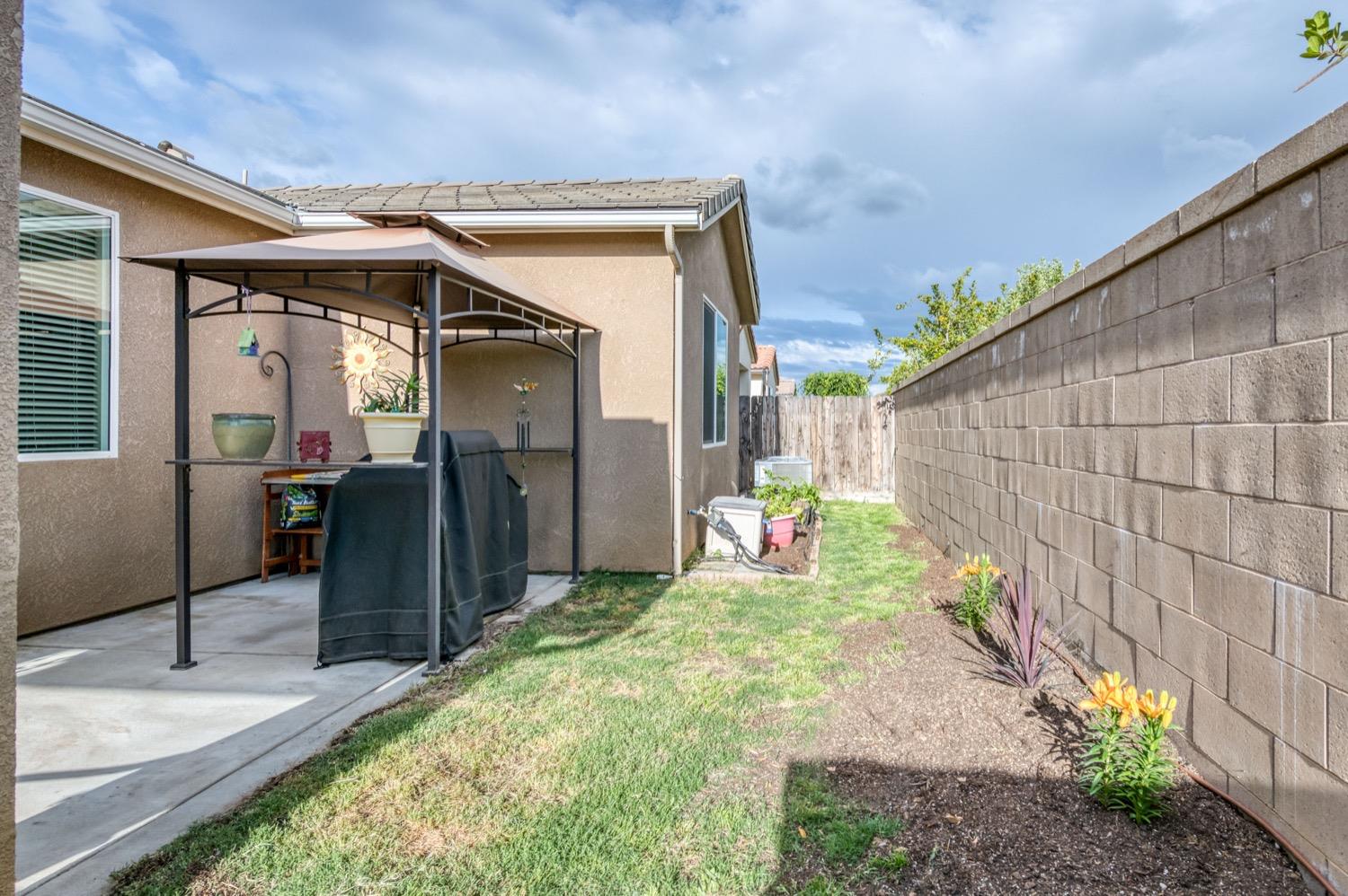 3610 Griffith Avenue Clovis, CA 93619 - Photo 21 of 22 a backyard of a house with seating space