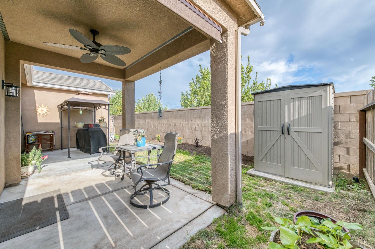 3610 Griffith Avenue Clovis, CA 93619 - Photo 22 of 22 a view of a porch with furniture and a yard