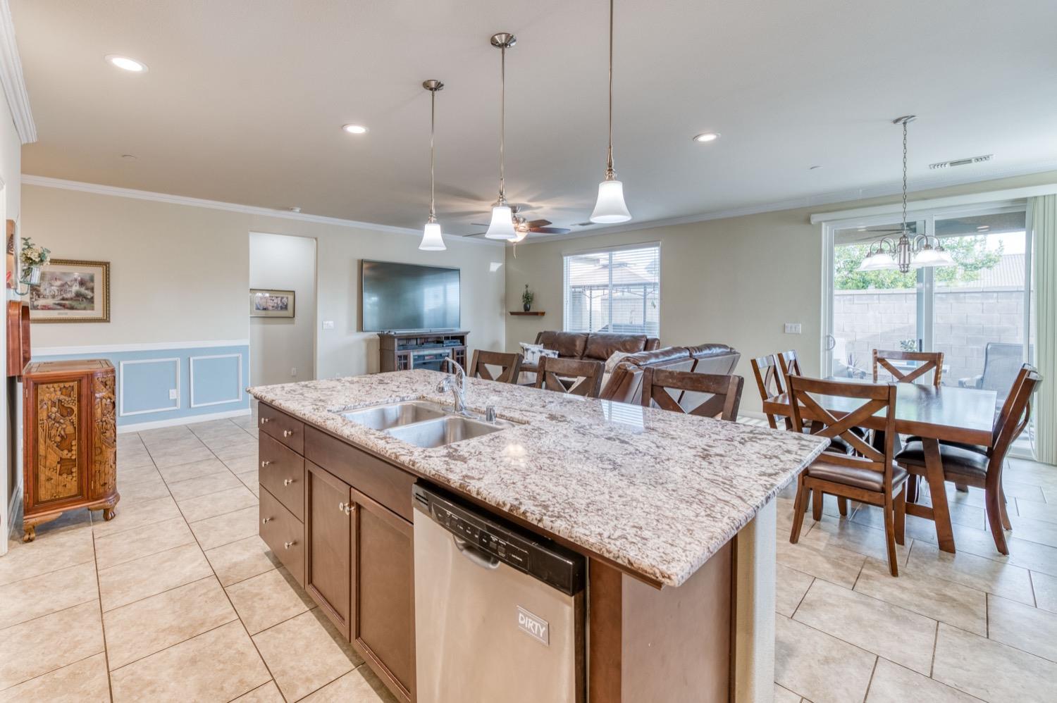3610 Griffith Avenue Clovis, CA 93619 - Photo 8 of 22 a view of a kitchen and dining table