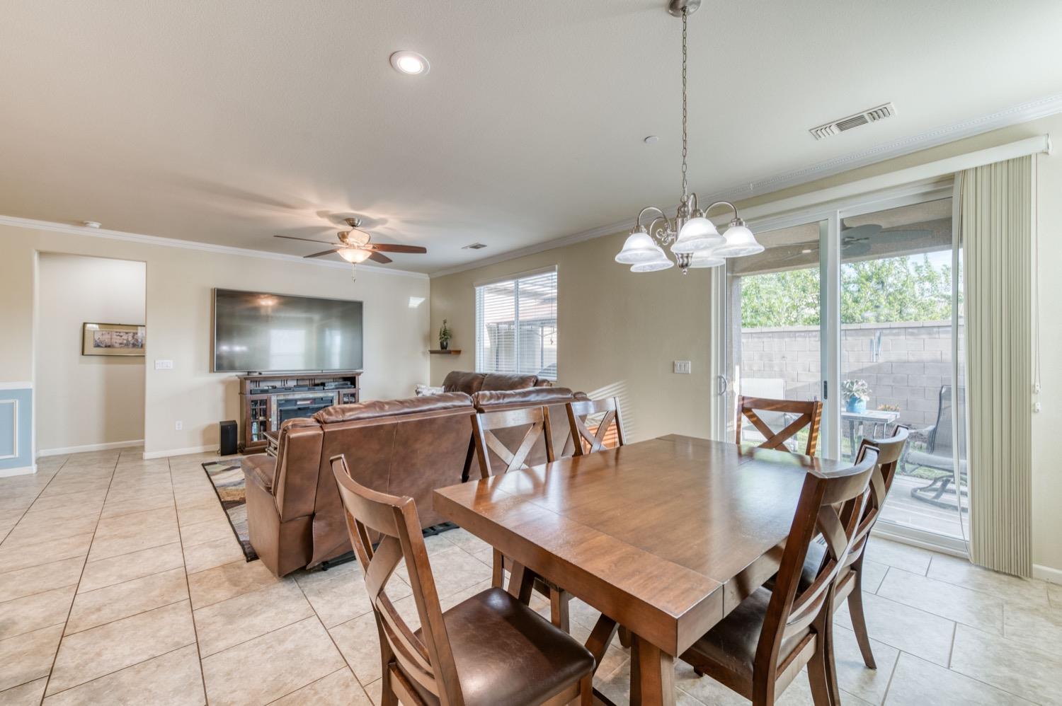3610 Griffith Avenue Clovis, CA 93619 - Photo 10 of 22 a view of a dining room with furniture window and outside view