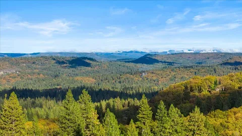a view of mountain and green field