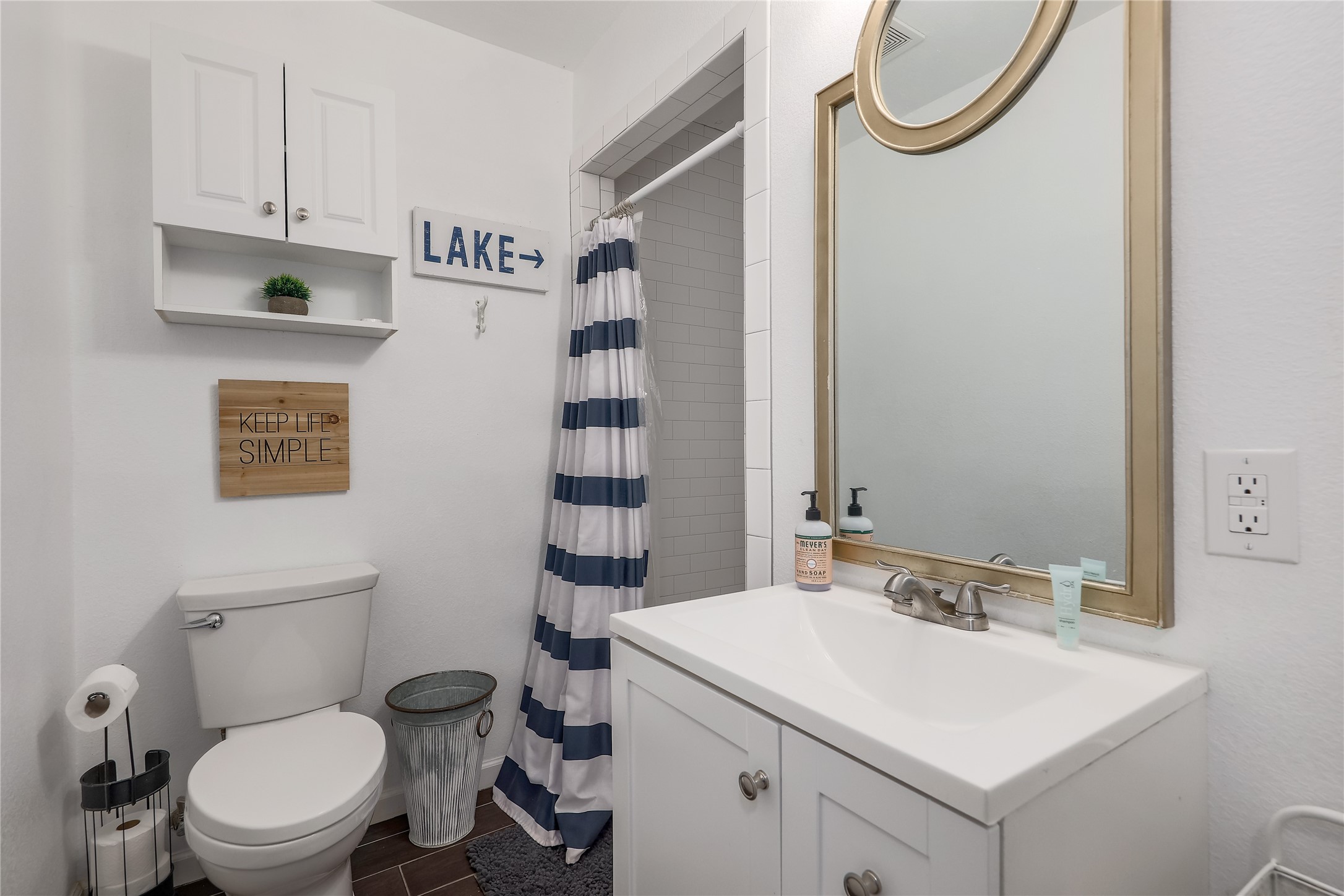 525 Ellen Williams Loop Kingsland, TX 78639 - Photo 23 of 36 a bathroom with a sink a toilet and a mirror