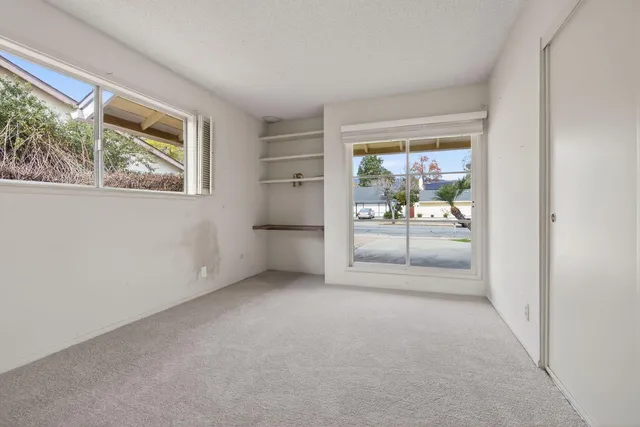 an empty room with a fireplace