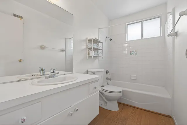 a bathroom with a sink a toilet and a bathtub