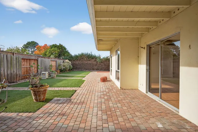 a view of a backyard with sitting area