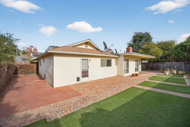 a front view of house with yard and seating area