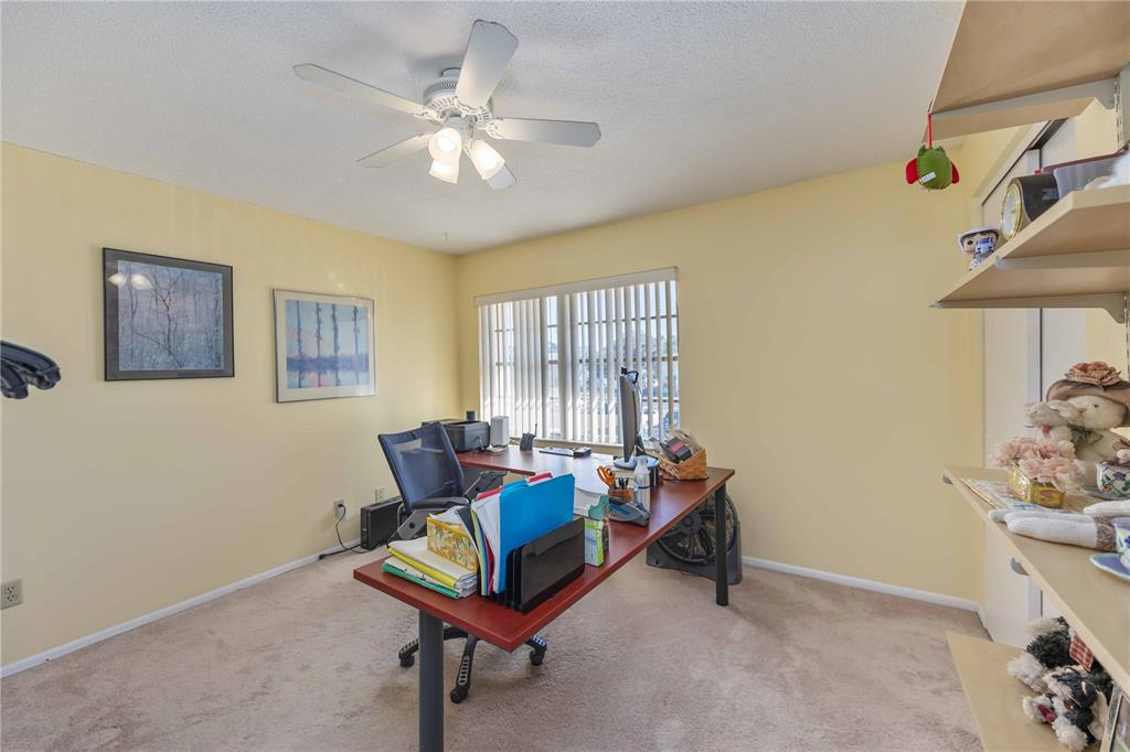 4885 Rilma Avenue, Unit 131 Sarasota, FL 34234 - Photo 14 of 25 a living room with furniture and a window