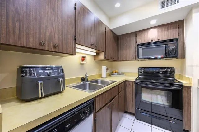 a kitchen with a stove and a sink