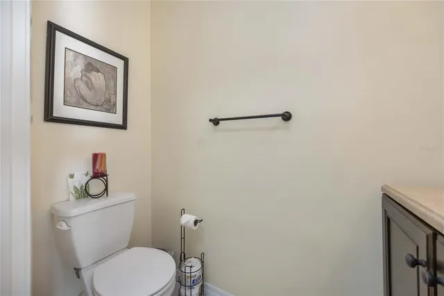 a white toilet sitting next to a bathroom sink