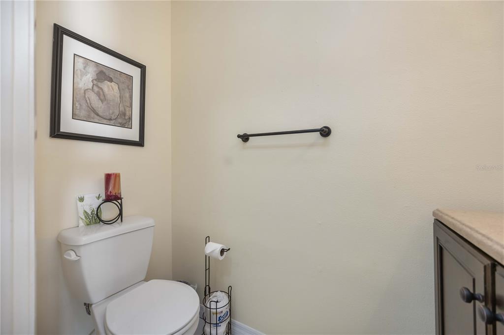 4885 Rilma Avenue, Unit 131 Sarasota, FL 34234 - Photo 10 of 25 a white toilet sitting next to a bathroom sink