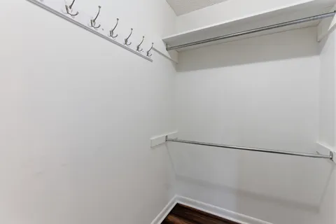 a bathroom with a sink a toilet and a window