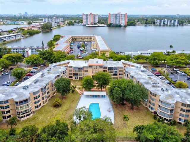 an aerial view of a house with outdoor space