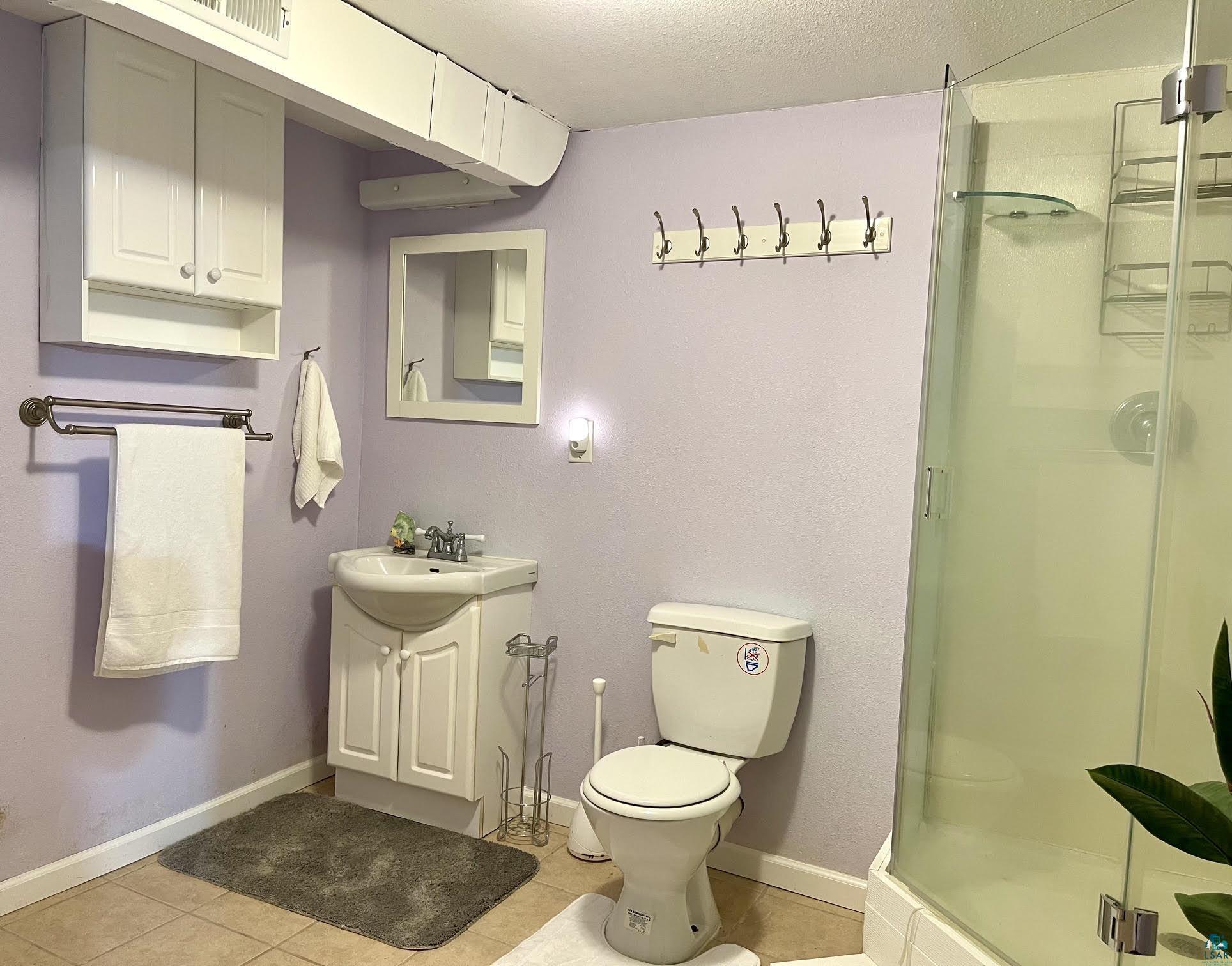 4804 Kroll Road Saginaw, MN 55779 - Photo 24 of 33 Lower level 3/4 bath tiled floor