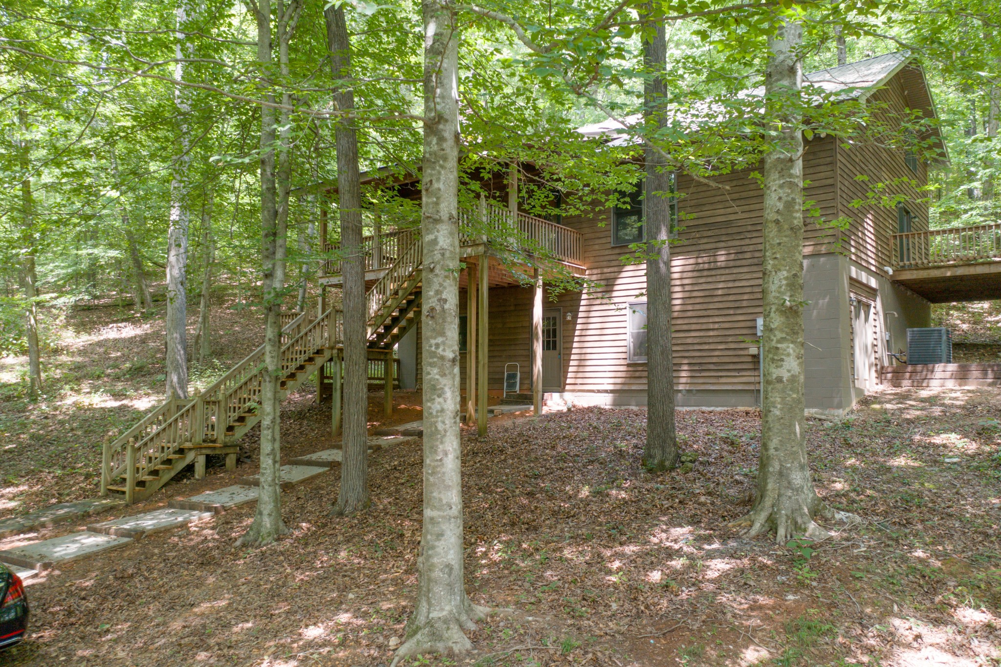 a backyard of a house with lots of green space