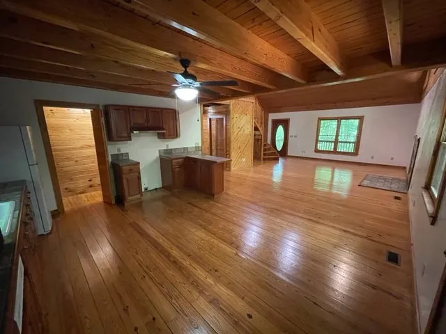 a bathroom with a toilet a sink and a shower