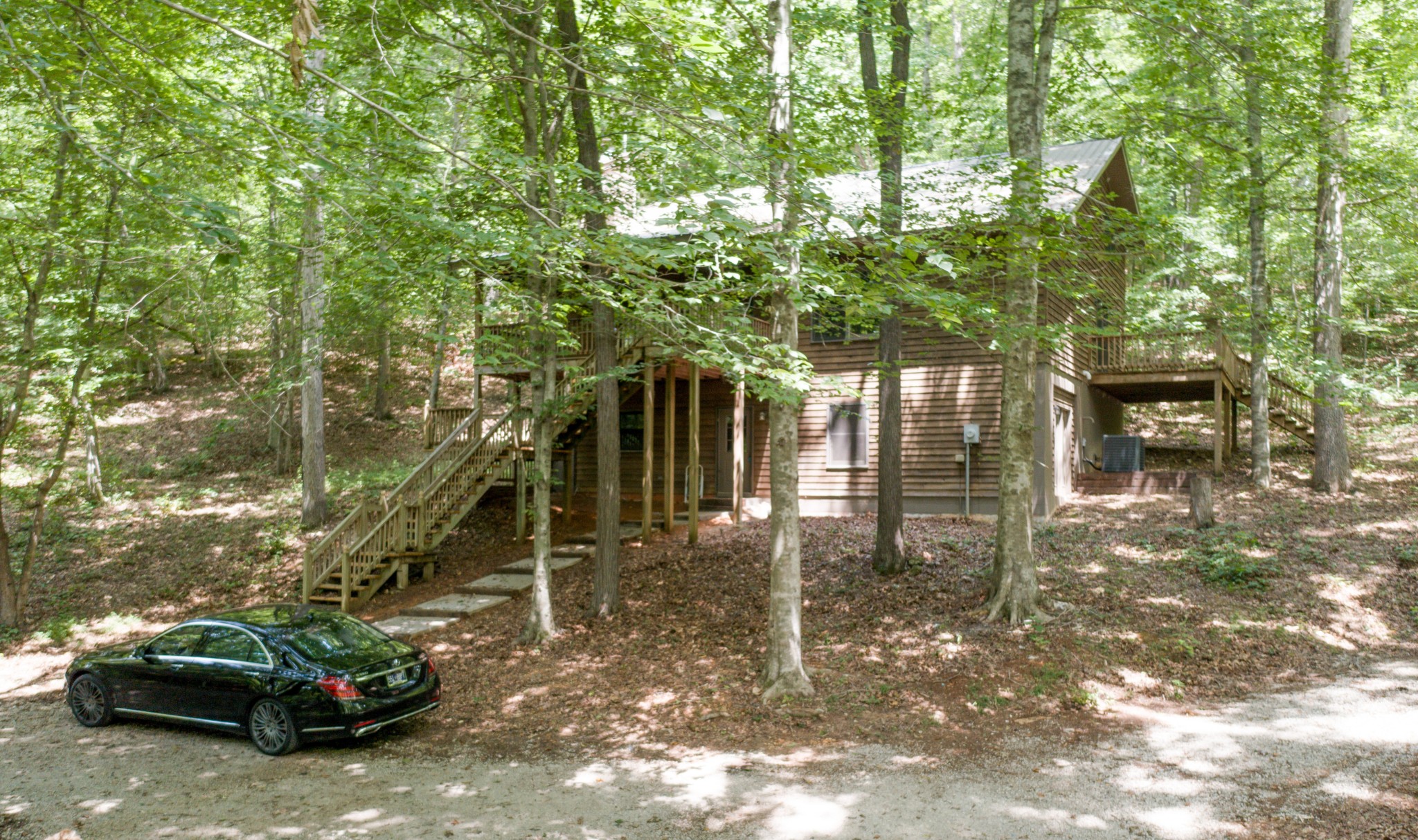 551 Shippmans Creek Road Wartrace, TN 37183 - Photo 23 of 48 a view of a house with a cars park
