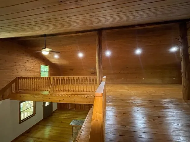a view of a room with wooden floor