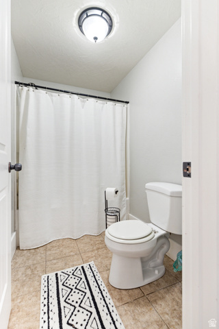 580 Cherry Ridge Lane Richmond, UT 84333 - Photo 45 of 53 Bathroom with curtained shower and light tile patterned floors