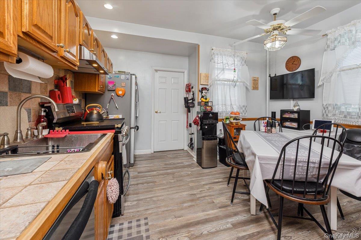 1007 Sacket Avenue Bronx, NY 10462 - Photo 14 of 29 a kitchen that has a table and chairs in it