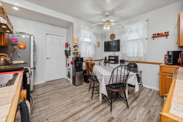 a view of a dining room with furniture and wooden floor