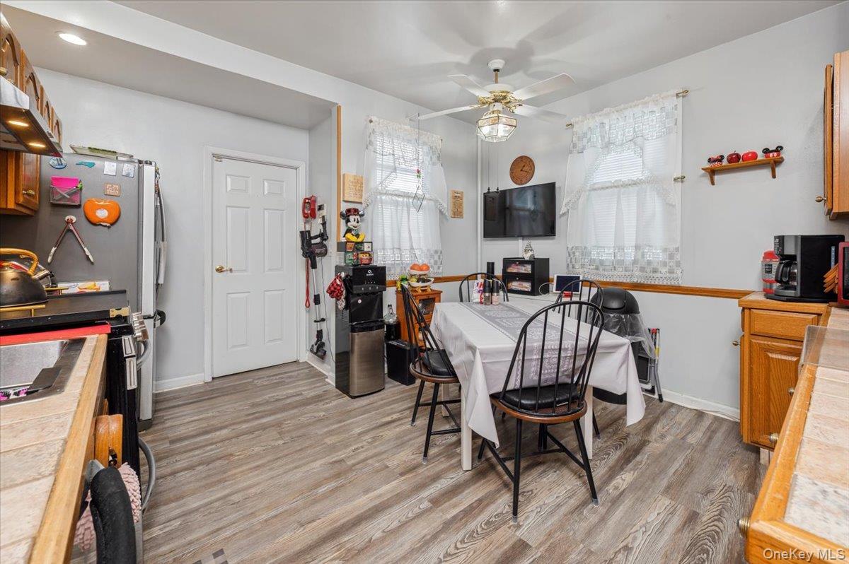 1007 Sacket Avenue Bronx, NY 10462 - Photo 15 of 29 a view of a dining room with furniture and wooden floor